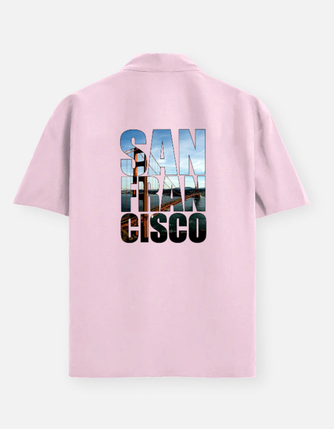 Pink polo shirt with 'San Francisco Cisco' text on the back against a white background