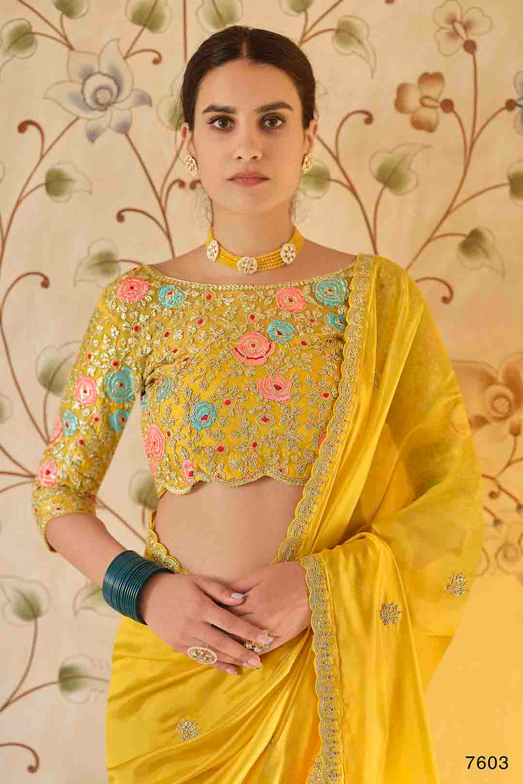Yellow organze saree with floral non stitched soft net  embroidered blouse.