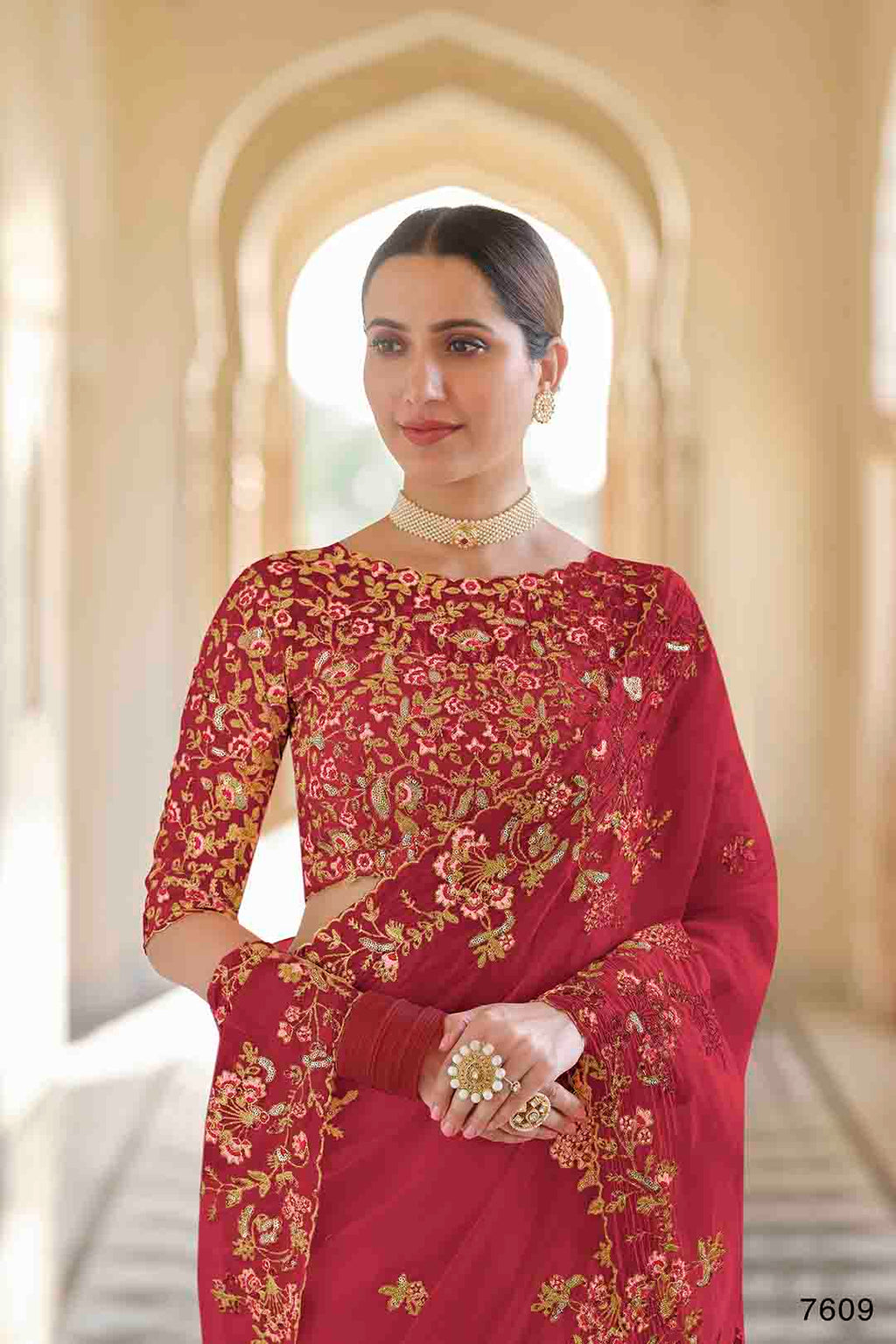 Woman wearing a red and gold embroidered Organza
Saree & non stitched Dori, Thread, Sequins Organza Blouse.