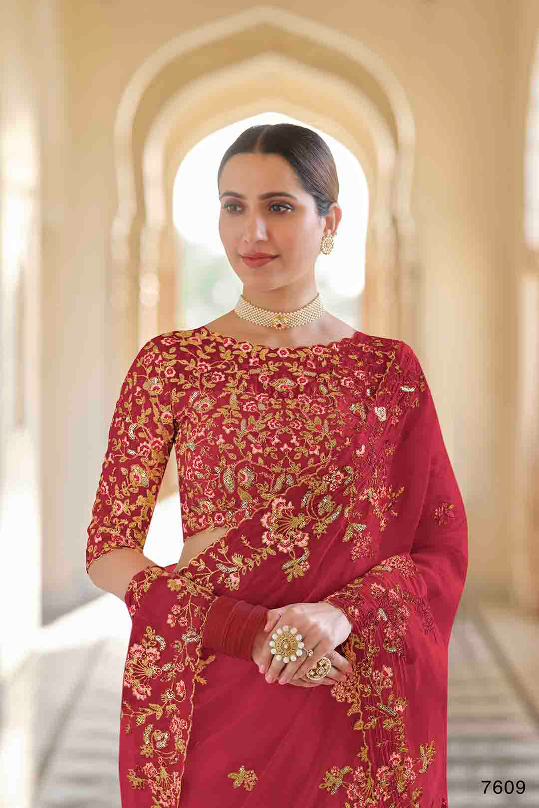 Woman wearing a red and gold embroidered Organza
Saree & non stitched Dori, Thread, Sequins Organza Blouse.