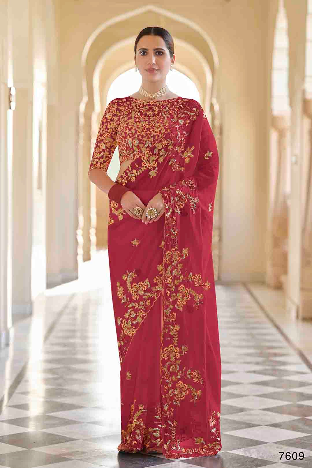 Woman wearing a red and gold embroidered Organza
Saree & non stitched Dori, Thread, Sequins Organza Blouse.