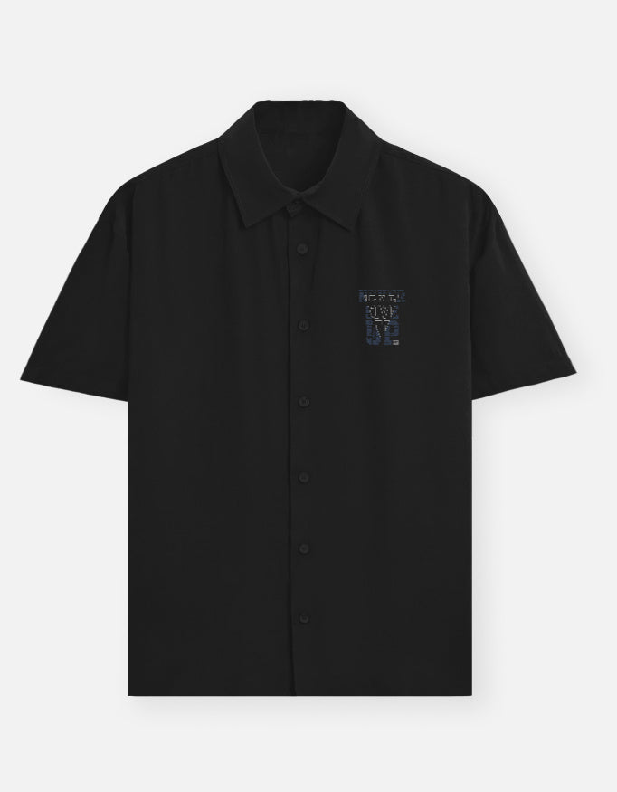 Black shirt with colorful text on a white background