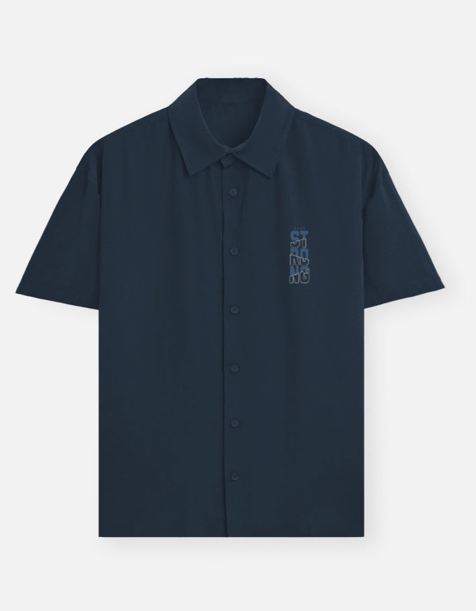 blue short-sleeve shirt with a small embroidered design.
