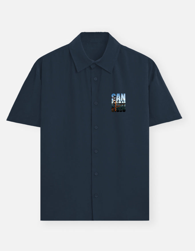 Black short-sleeve shirt with a small embroidered design on a white background