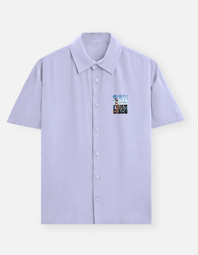 Light purple shirt with colorful graphic on the chest against a white background