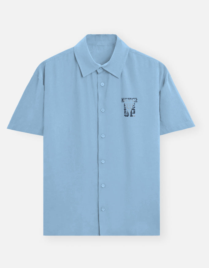 Light blue shirt with a logo on a white background