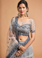 Ceremonial Zari Net A Line Lehenga Choli In Grey